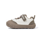 Side view of EBMINI BREEZE brown toddler sneaker with flexible segmented sole