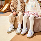 EBMINI ORBIT child wearing the sneakers during active playground play