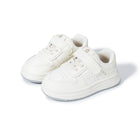 Pair of all-white EBMINI RACER barefoot kids sneakers