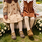 Girl wearing EBMINI SAVANNA leopard Mary Janes with a dress